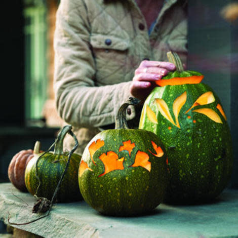 Encircle a few pumpkins with slender carvings