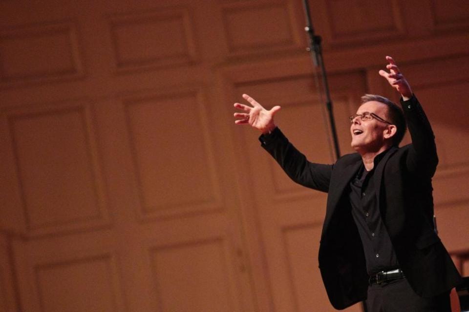 Composer Craig Hella Johnson conducts "Considering Matthew Shepard" in 2017 at Symphony Hall in Boston with the musical group Conspirare and the Berklee College of Music.