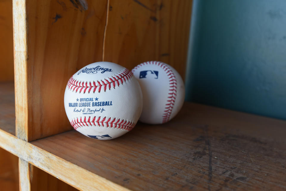 LAKELAND, FL - MARCH 01:  A detailed view of a pair of official Rawlings Major League Baseball baseballs with the imprinted signature of  Robert D. Manfred Jr., the Commissioner of Major League Baseball, sitting in the dugout prior to the Spring Training game between the New York Yankees and the Detroit Tigers at Publix Field at Joker Marchant Stadium on March 1, 2020 in Lakeland, Florida. The Tigers defeated the Yankees 10-4.  (Photo by Mark Cunningham/MLB Photos via Getty Images)