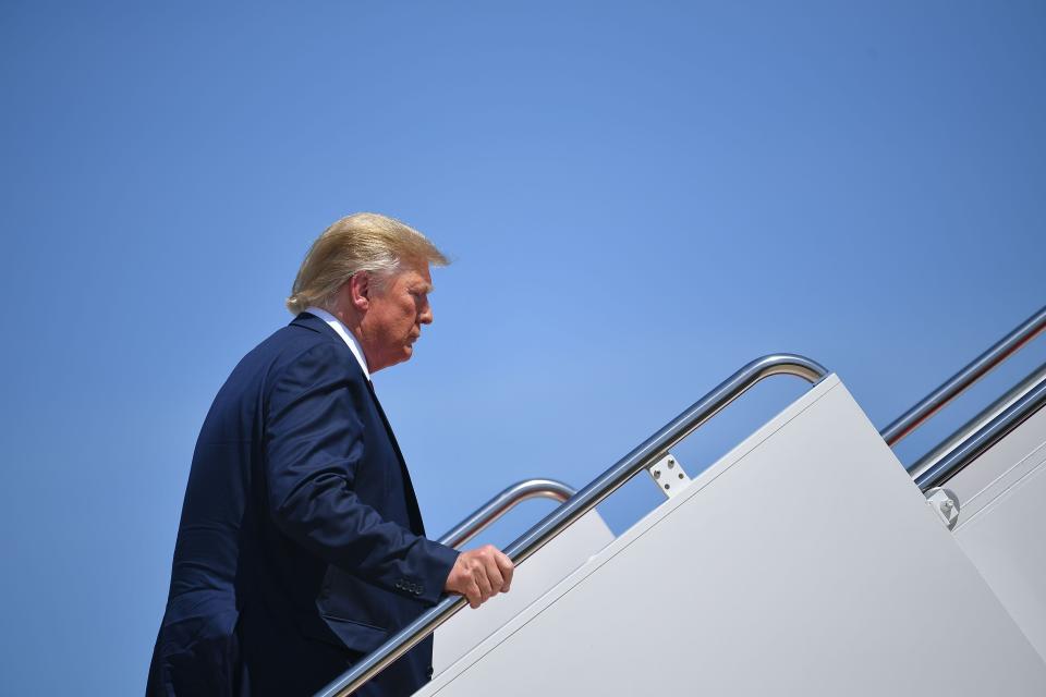 Donald Trump boards Air Force One before departing from Andrews Air Force Base in Maryland on August 21, 2019.