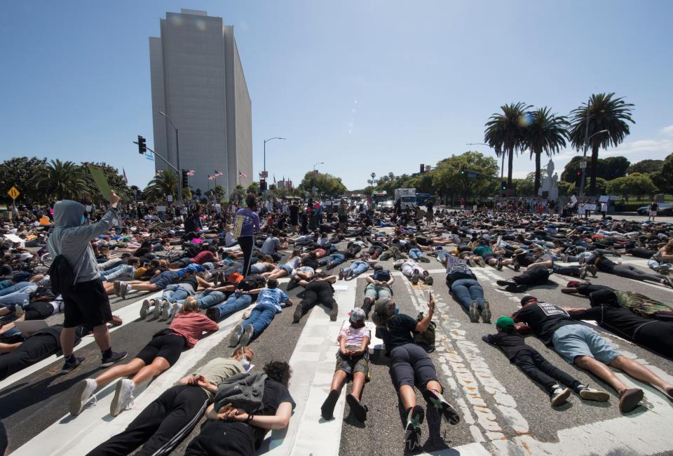 Protesters and supporters of Black Lives Matter lie in the street in Westwood, California. Source: Getty Images