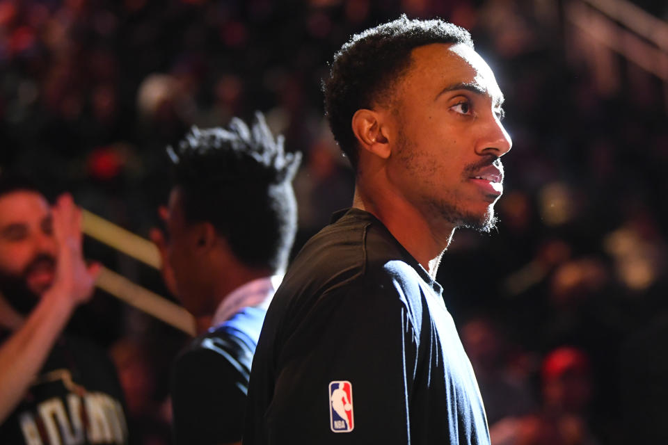 Atlanta Hawks guard Jeff Teague looks on as teammates are introduced before an NBA basketball game against the Detroit Pistons, Saturday, Jan. 18, 2020, in Atlanta. (AP Photo/John Amis)