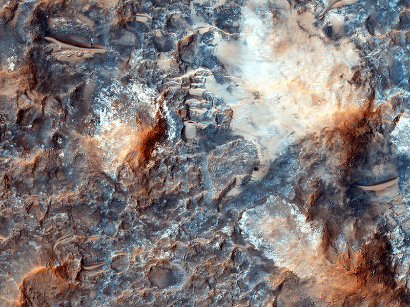 "'Megabreccia' is a term we use to describe jumbled, fragmented blocks of rock larger than 1 meter across, in a matrix of finer-grained materials," per the HiRISE website. "It's the result of energetic processes, typically from an impact event."