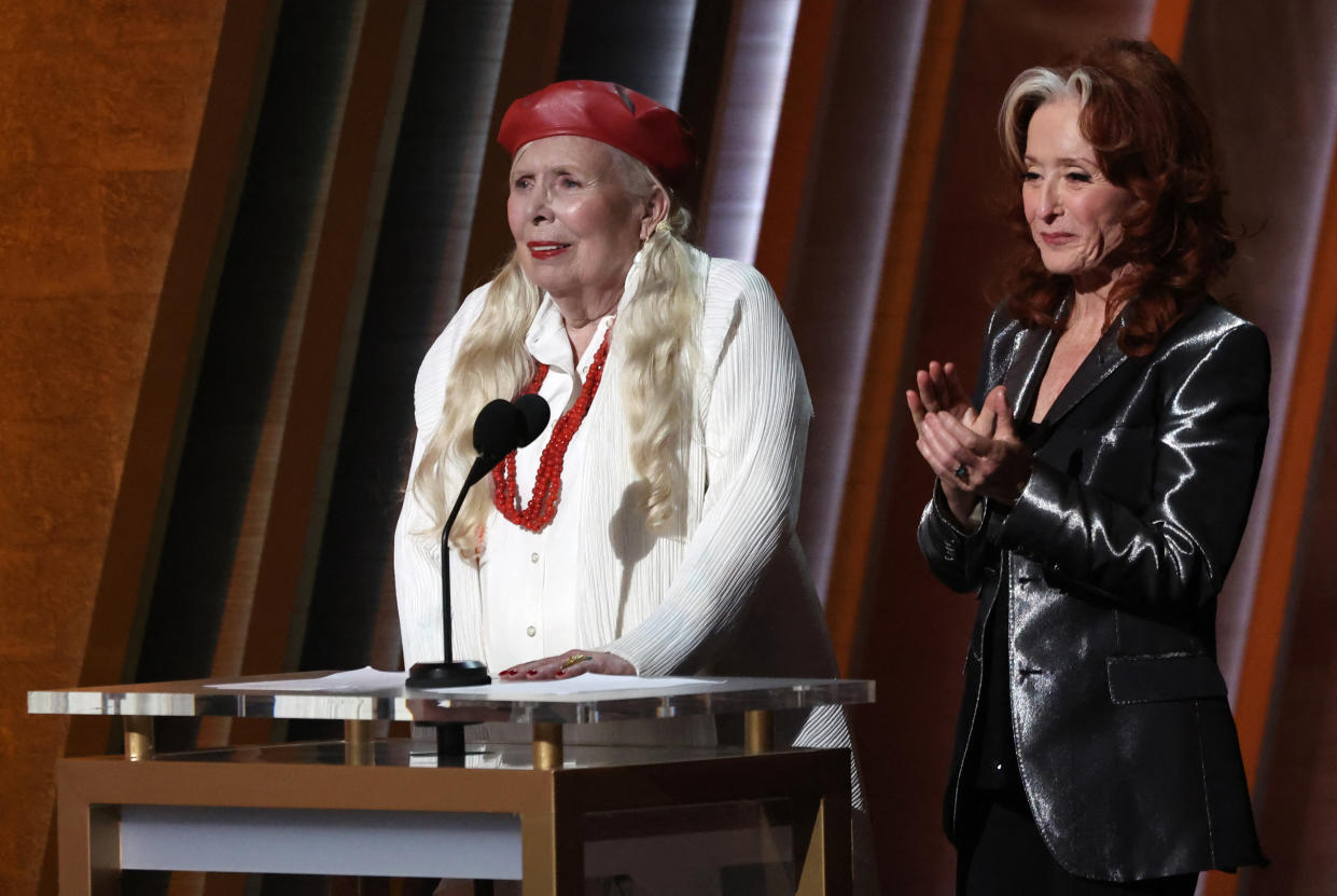 MusiCares 2022 Person of the Year Joni Mitchell and Bonnie Raitt (R) introduce Brandi Carlile to perform during the 64th Annual Grammy Awards show in Las Vegas, Nevada, U.S., April 3, 2022.  REUTERS/Mario Anzuoni