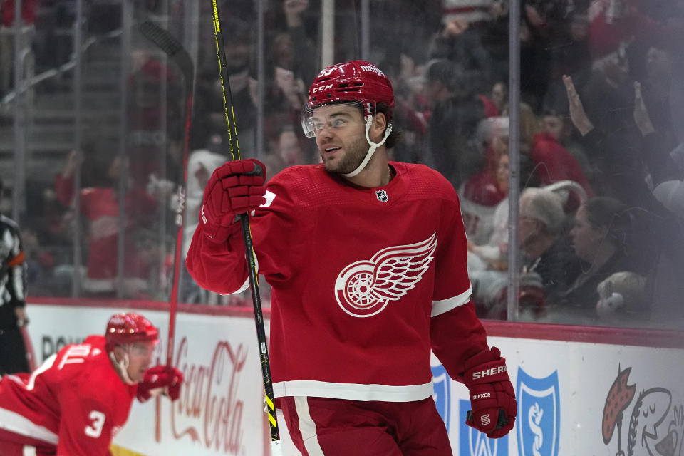 Detroit Red Wings right wing Alex DeBrincat (93) celebrates his goal against the Calgary Flames in the first period of an NHL hockey game Sunday, Oct. 22, 2023, in Detroit. (AP Photo/Paul Sancya)