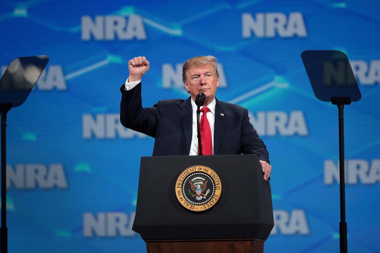 US President Donald Trump gestures to guests at the NRA-ILA Leadership Forum at the 148th NRA Annual Meetings & Exhibits on April 26, 2019 in Indianapolis, Indiana.