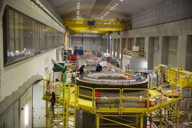 A generator at the Linthal pumped storage power plan assemble rotors for one the pump’s new turbines. <span class="inline-image-credit">(GE Reports/Tomas Kellner)</span>