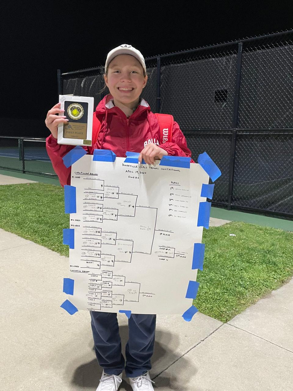 Ballard's Kaitlyn Zugay poses for a photo after taking first in singles at the Knoxville Invitational on Friday, April 19, 2024.