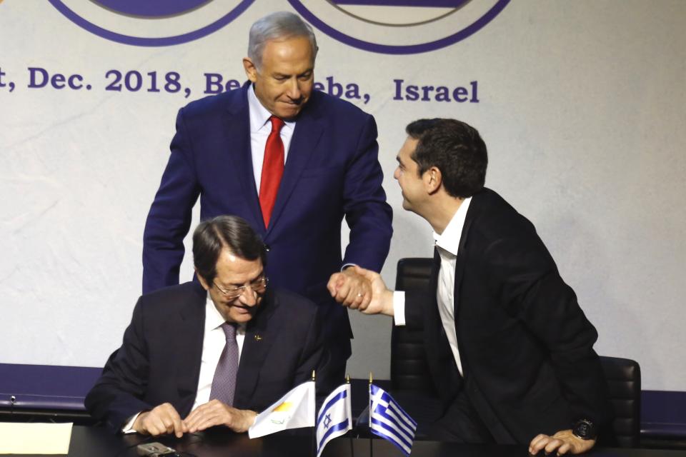 Israeli Prime Minister Benjamin Netanyahu, center, Greek Prime Minister Alexis Tsipras, right, and Cyprus' President Nicos Anastasiades meet during the 5th trilateral summit with Greece and Cyprus in Beersheba, Israel, Thursday, Dec. 20, 2018. (AP Photo/Ariel Schalit)