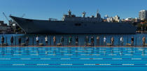 <p>Australia’s naval ship HMAS Canberra forms a backdrop as Sydney’s Andrew “Boy” Charlton swimming pool hosts a men’s fashion show for the Katama label by American designer Garrett Neff during Fashion Week Australia Sydney in Sydney, Australia, May 16, 2017. (Photo: Jason Reed/Reuters) </p>