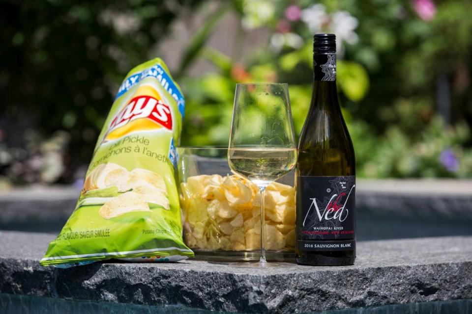 White wine and dill pickle potato chips – the perfect summer pairing. <a href="https://www.gettyimages.com/detail/news-photo/august-9-2017-2016-the-ned-sauvignon-blanc-waihopai-river-news-photo/842882030?adppopup=true" rel="nofollow noopener" target="_blank" data-ylk="slk:Anne-Marie Jackson/Toronto Star via Getty Images;elm:context_link;itc:0;sec:content-canvas" class="link ">Anne-Marie Jackson/Toronto Star via Getty Images</a>