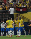 Brazil's Gabriel Barbosa, center, celebrates with teammates after scoring his side's 4th goal against Uruguay during a qualifying soccer match for the FIFA World Cup Qatar 2022 at Arena da Amazonia in Manaus, Brazil, Thursday, Oct.14, 2021. (AP Photo/Andre Penner)