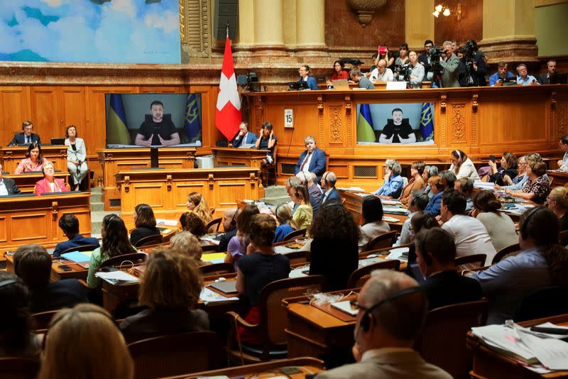 Ukraine's President Volodymyr Zelenskiy addresses Swiss Parliament via video message, in Bern