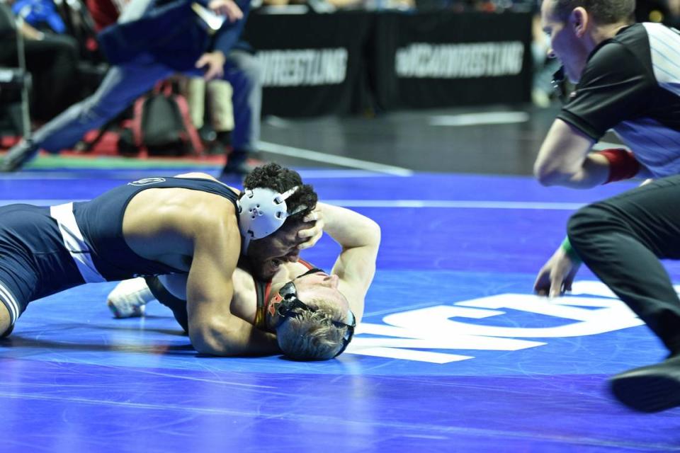Penn State’s Shayne Van Ness aims to pin Maryland’s Ethen Miller in their 149-pound first round match of the NCAA Championships on Thursday, March 16, 2023 at the BOK Center in Tulsa, Okla. Van Ness rallied to pin Miller in 6:26.