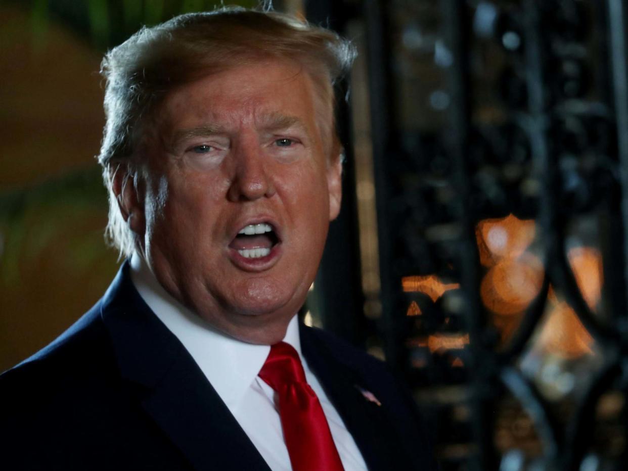 US president Donald Trump speaks to media after taking part in video conference with members of US military at his private Mar-a-Lago resort in Palm Beach, Florida, 24 December, 2019: Reuters