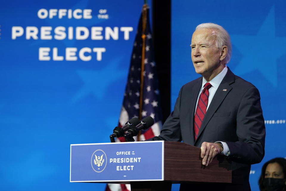 President-elect Joe Biden speaks during an event at The Queen theater in Wilmington, Del., Tuesday, Dec. 8, 2020, to announce his health care team. Vice President-elect Kamala Harris listens at right. (AP Photo/Susan Walsh)