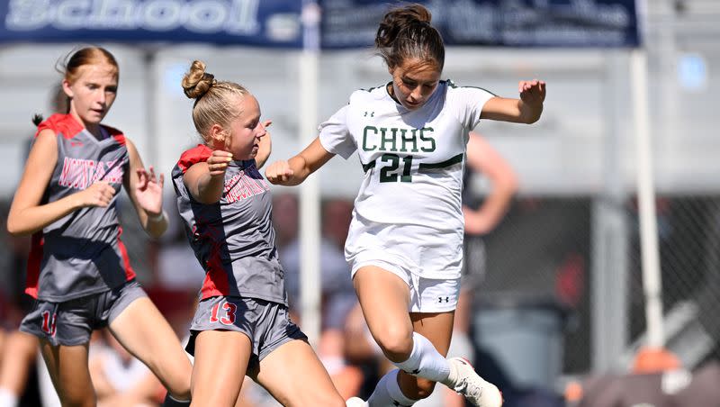 Mountain Ridge’s Emelia White and Copper Hills’ Brenna Arauzo battle each other as they play in Herriman on Tuesday, Aug. 29, 2023. Mountain Ridge won 3-0.