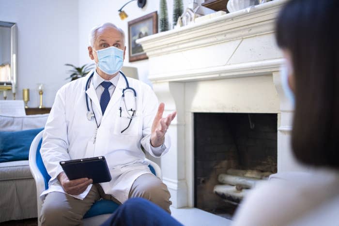 Doctor visiting a patient in their home