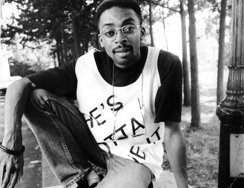 Spike Lee wearing a T-shirt from his movie 