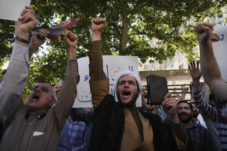 Iranian demonstrators chant slogans during a protest of the burning of a Quran in Sweden, in front of the Swedish Embassy in Tehran, Iran, Friday, June 30, 2023. On Wednesday, a man who identified himself in Swedish media as a refugee from Iraq burned a Quran outside a mosque in central Stockholm. (AP Photo/Vahid Salemi)