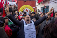 <p>Tunisian workers stage a protest in front of the national union headquarters in the capital Tunis, Thursday, Jan. 17, 2019. Workers around Tunisia are on strike to demand higher pay in a standoff with a government struggling to tame unemployment, poverty and social tensions. (AP Photo/Hassene Dridi) </p>