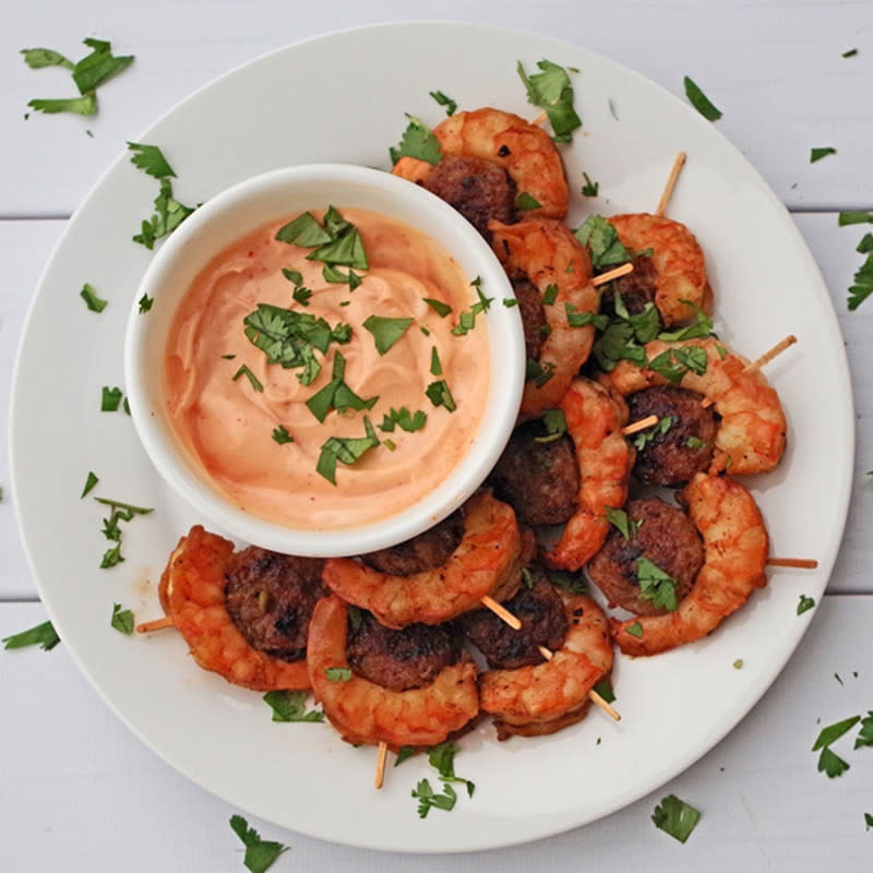 <p>Gluten Free Palate</p><p>Smoky sausage and spicy shrimp with a delicious dipping sauce. This is bound to be a hit at your party!</p><p><strong>Get the recipe: </strong><a href="https://www.glutenfreepalate.com/sausage-shrimp-appetizer/" rel="nofollow noopener" target="_blank" data-ylk="slk:Sausage & Shrimp Appetizer With Sriracha Mayo;elm:context_link;itc:0;sec:content-canvas" class="link "><strong>Sausage & Shrimp Appetizer With Sriracha Mayo</strong></a></p>