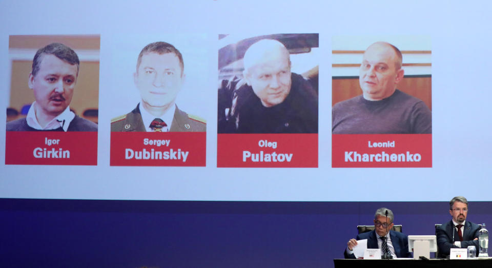 Russian nationals Igor Girkin, Sergey Dubinskiy and Oleg Pulatov, as well as Ukrainian Leonid Kharchenko, accused of downing of flight MH17, are shown on screen as international investigators present their latest findings in the downing of Malaysia Airlines flight MH17, nearly five years after the crash that killed 298 passengers and crew, in Nieuwegein, Netherlands, June 19, 2019.  REUTERS/Eva Plevier