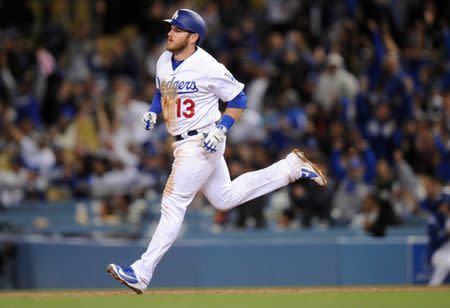 May 11, 2018; Los Angeles, CA, USA; Los Angeles Dodgers third baseman Max Muncy (13) rounds the bases after hitting a solo home run in the seventh inning agains the Cincinnati Reds at Dodger Stadium. Mandatory Credit: Gary A. Vasquez-USA TODAY Sports