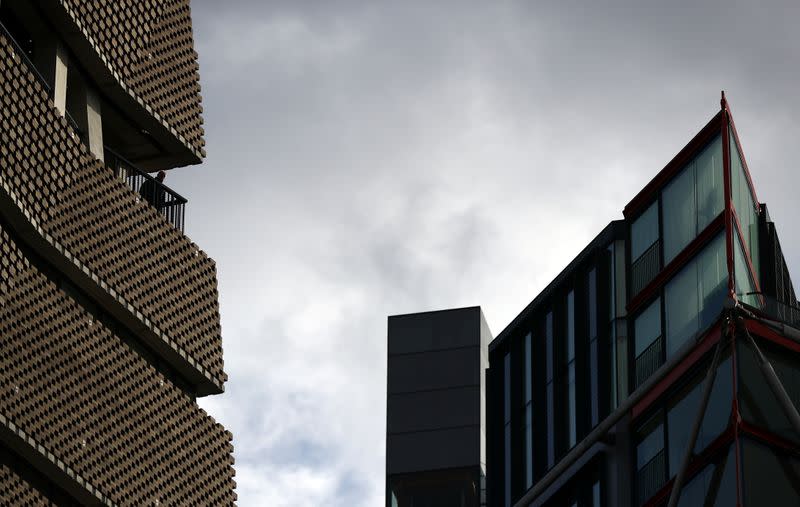 A man looks out from the Viewing Level at the Tate Modern gallery in London