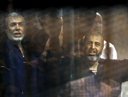 CAGED: Muslim Brotherhood members in court in Cairo in June. REUTERS/Asmaa Waguih