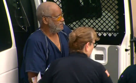 James Matthew Bradley Jr. is escorted from a prisoners van before appearing briefly in federal court, authorities found eight men dead in the back of his tractor trailer truck, in a still image from video taken in San Antonio, Texas, U.S. July 24, 2017. Courtesy of KENS5.com/San Antonio, Texas via REUTERS