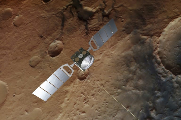 A photograph obtained from the European Space Agency shows an artist's impression of Mars Express over a background based on an actual image of the Red Planet taken by the spacecraft