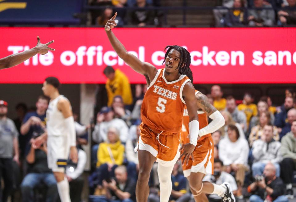 Texas guard Marcus Carr celebrates after a basket during the second half of a win at West Virginia last month. He shook off a brief scoring slump with 29 points against Kansas this week, and he'll lead the Longhorns into a rematch with the Mountaineers on Saturday at Moody Center.