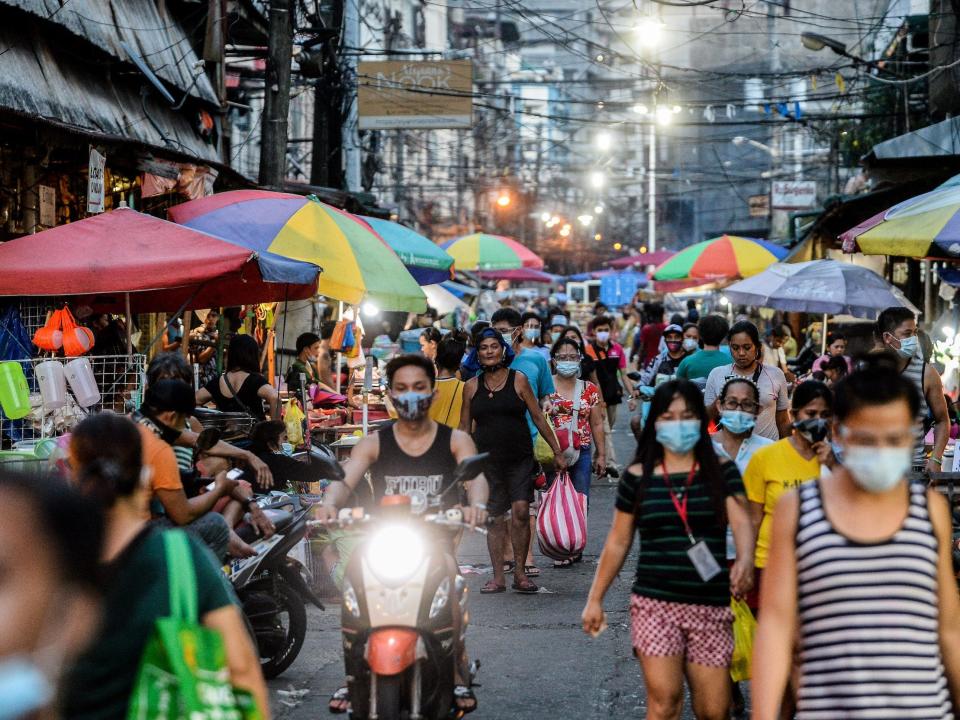 People shop at a public market in Manila, Philippines on August 23, 2020. The total number of COVID-19 cases in the Philippines rose to 189,601 after 2,378 new cases have been recorded.(Photo by Lisa Marie David/NurPhoto via Getty Images)