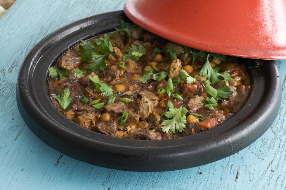 In this image taken on March 18, 2013, rosemary lamb tagine with chickpeas and tomatoes is shown served on a plate in Concord, N.H. (AP Photo/Matthew Mead)