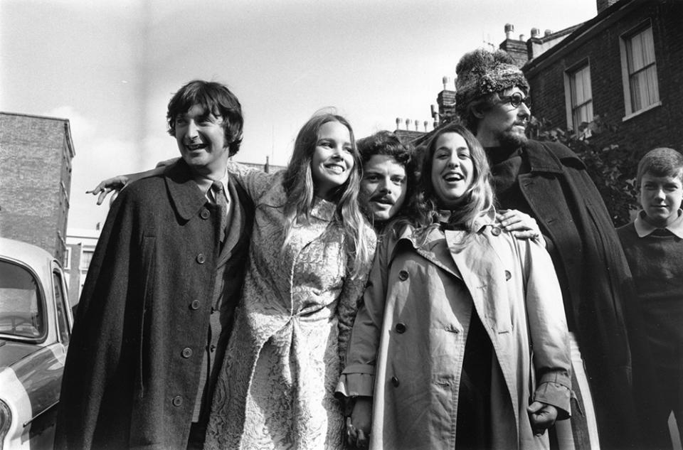 6th October 1967:  California based pop-folk vocal harmony group Mamas And The Papas in England, celebrating after theft charges were dropped against 'Mama' Cass Elliot who was accused of stealing blankets and keys from the Royal Garden Hotel in Kensington on an earlier visit. From left to right, Denny Doherty, Michelle Gilliam (Michelle Philips), unknown, 'Mama' Cass Elliot (1943 - 1974) and John Phillips (1935 - 2001).  (Photo by Les Lee/Express/Getty Images)