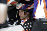 Denny Hamlin waits in his car during practice for Sunday's NASCAR Cup Series auto race at Charlotte Motor Speedway in Concord, N.C., Saturday, Sept. 28, 2019. (AP Photo/Gerry Broome)