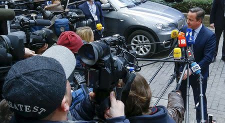 British Prime Minister David Cameron speaks to the media as he arrives at a European Union leaders summit addressing the talks about the so-called Brexit and the migrants crisis in Brussels, Belgium, February 18, 2016. REUTERS/Yves Herman