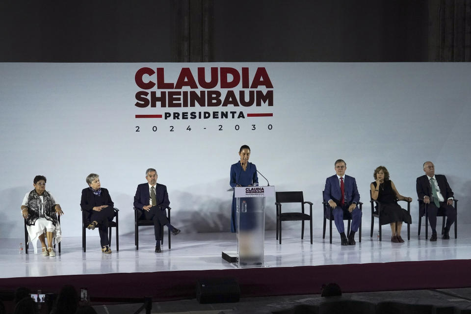 Incoming President Claudia Sheinbaum speaks flanked by members of her newly-named Cabinet, in Mexico City, Thursday, June 20, 2024. Pictured from left to right: Ernestina Godoy, legal advisor, Alicia Bárcena, secretary of environment and natural resources, Juan Ramón de la Fuente, foreign affairs secretary, Marcelo Ebrard, economy secretary, Rosaura Ruiz, appointed to a new ministry overseeing science, humanities, technology and innovation, and Julio Berdegué Sacristán, secretary of agriculture and rural development. (AP Photo/Marco Ugarte)