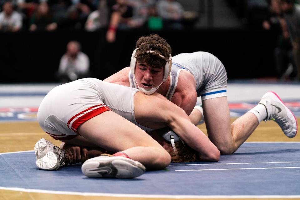 Poudre's Banks Norby pins down Ponderosa's Payton Harris during a 3rd place match in the Colorado state wrestling tournament at Ball Arena on Feb. 18, 2023, in Denver.