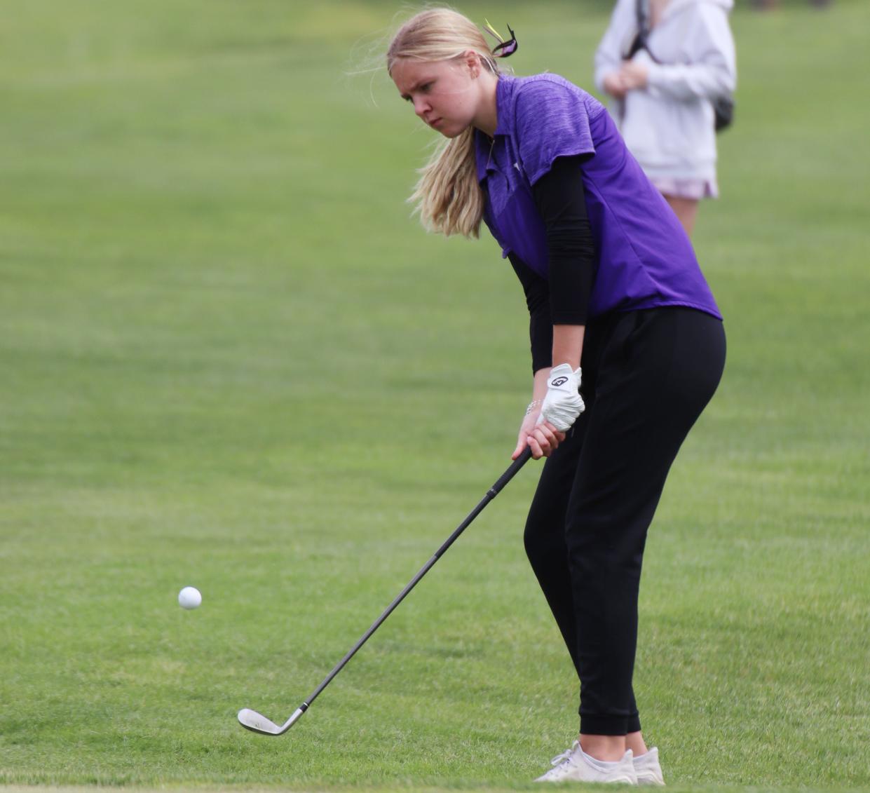 Watertown's Ellie Zink chips the ball onto the 18th green during the state Class AA Girls Golf Tournament at Brookings Country Club on Monday.