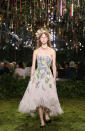 <p>What makes this ecru fringe cocktail dress with floral raffia and thread embroidery worthy of haute couture status? The design is a Monsieur Dior original, and 1,900 hours of work went into creating this one dress! The headwear is hedgerow in silk flowers and corn. Do I need to say more? (Photo: Getty Images) </p>