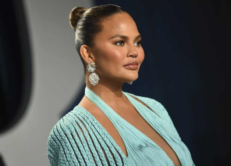 Chrissy Teigen arrives at the Vanity Fair Oscar Party on Sunday, Feb. 9, 2020, in Beverly Hills, Calif.