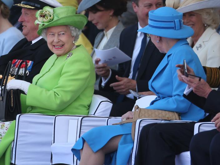Queen Elizabeth II (L) smiles at Queen Margrethe II of Denmark during the International Ceremony at Sword Beach to commemorate the 70th anniversary of the D-Day Invasion on June 6, 2014 in Ouistreham, France.