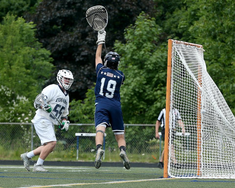 Cohasset's Robbie Norton watches his shot hit the back of the net to give Cohasset the 10-4 lead over Hamilton-Wenham during fourth quarter action of their game in the Sweet 16 round of the Division 4 state tournament at Cohasset High School on Saturday, June 11, 2022. 