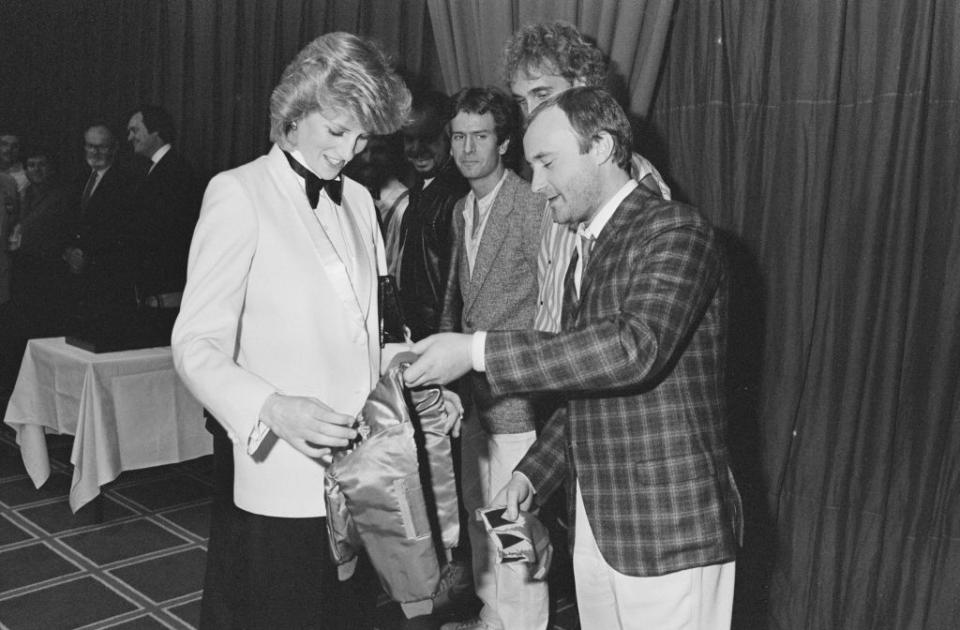 <p>The Genesis singer met Princess Diana in 1984 at a royal charity concert and wore a checkered sport coat with khaki pants. He also brought a miniature satin bomber jacket for the expectant mother.</p>