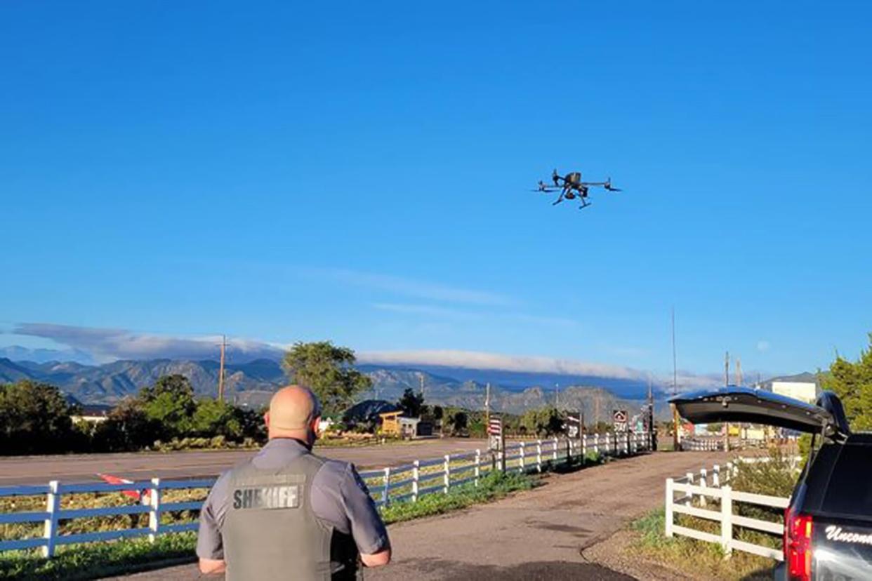 officer from the Fremont, Colorado sheriff's department using a drone to search for missing golden retriever