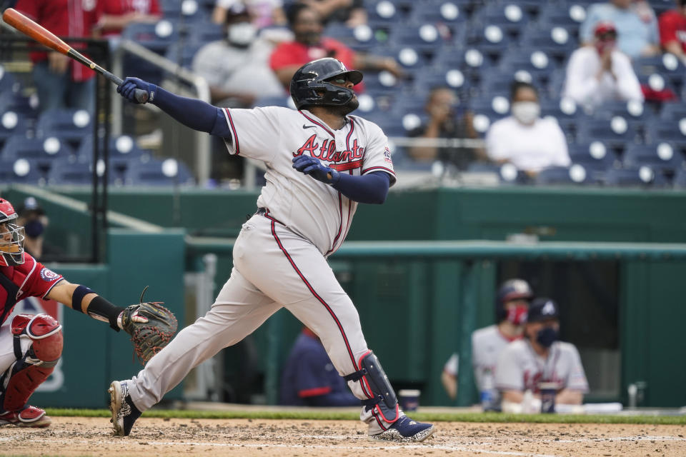 Atlanta Braves' Pablo Sandoval watches his two-run home run during the seventh inning of the second baseball game of the team's doubleheader against the Washington Nationals at Nationals Park, Wednesday, April 7, 2021, in Washington. The Braves won 2-0. (AP Photo/Alex Brandon)