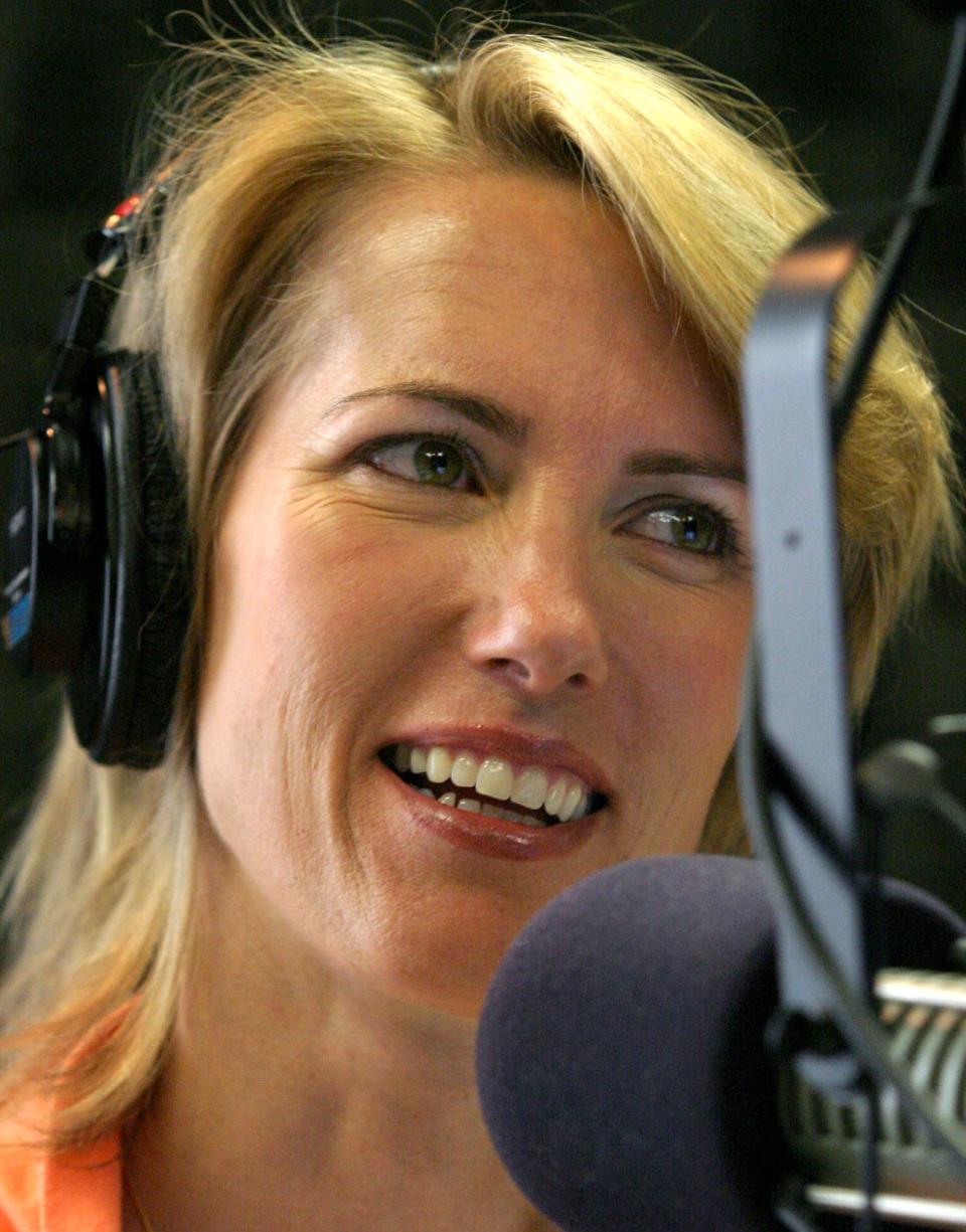 Laura Ingraham in her studio after the Laura Ingraham Show, as she talks with her producers who are off camera in 2004.