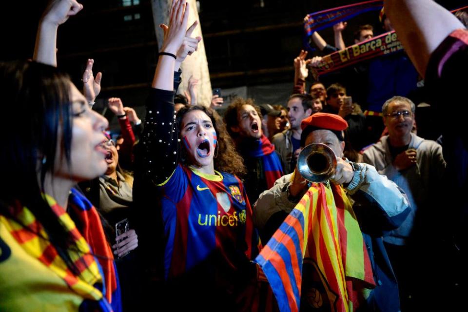 Barcelona fans celebrate in the city after claiming their 25th La Liga title.